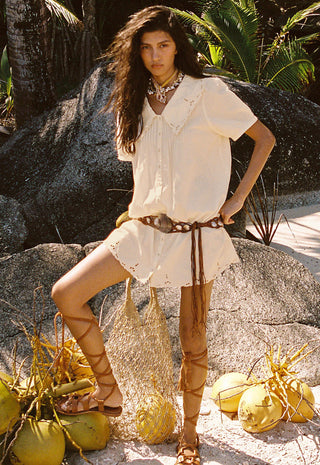  accessorized with a brown woven belt