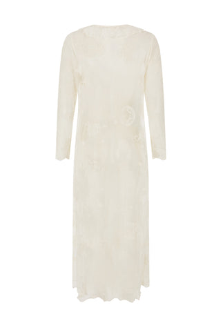  wearing a sheer white lace longline cardigan over a white lace camisole top and blue jeans